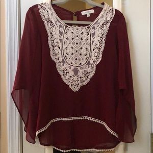 Burgundy blouse with lace detail